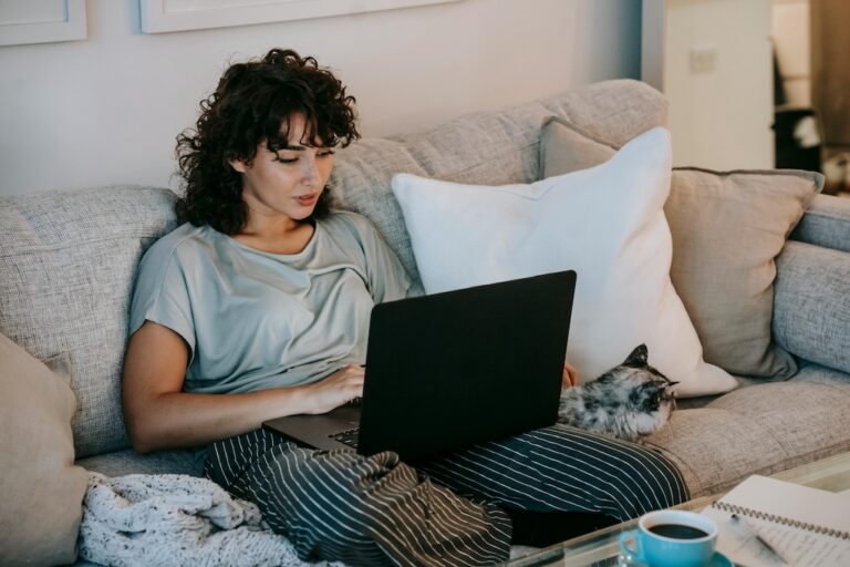 Women on couch with laptop